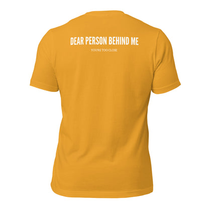 a mustard  t-shirt with white sarcastic , you're too close, text and smile on it