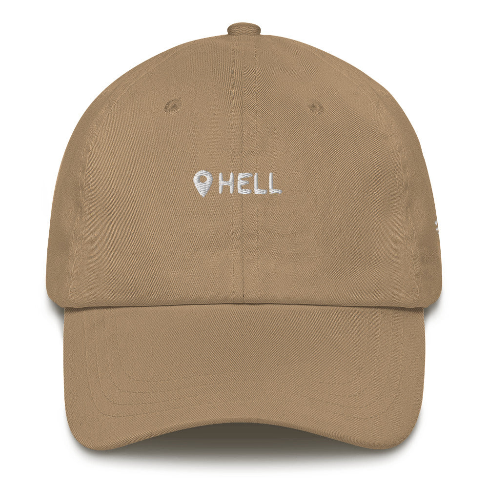 a beige or khaki hat with white sarcastic, hell, text on it